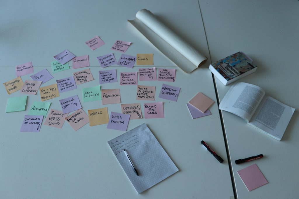 A tabletop with pastel coloured notes discussing ideas around vocabularies.